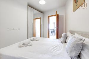 Voodi või voodid majutusasutuse A lovely 2BR home, in the centre of Marsaxlokk by 360 Estates toas