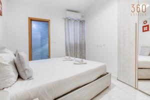 Voodi või voodid majutusasutuse A lovely 2BR home, in the centre of Marsaxlokk by 360 Estates toas
