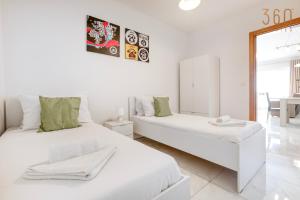 Voodi või voodid majutusasutuse A lovely 2BR home, in the centre of Marsaxlokk by 360 Estates toas