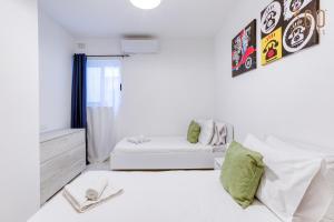 Voodi või voodid majutusasutuse A lovely 2BR home, in the centre of Marsaxlokk by 360 Estates toas