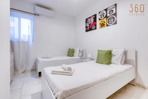 Voodi või voodid majutusasutuse A lovely 2BR home, in the centre of Marsaxlokk by 360 Estates toas