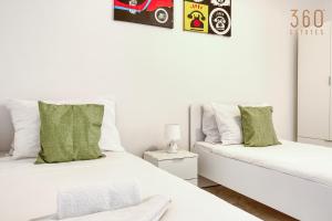 Voodi või voodid majutusasutuse A lovely 2BR home, in the centre of Marsaxlokk by 360 Estates toas