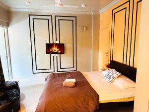 a bedroom with a bed with a lamp on it at The Studio: AC, WiFi, Smart Tv in Pune +5 photos