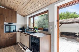 a kitchen with a sink and a large window at Apartment Bodman in Friedrichshafen in Friedrichshafen
