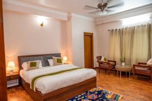 Voodi või voodid majutusasutuse Lumbini Five Elements Hotel toas