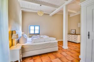 Postel nebo postele na pokoji v ubytování Ferienhaus Blaukehlchen Lieper Winkel, Rankwitz + 24 fotografií
