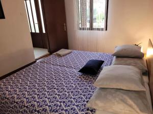 Ένα ή περισσότερα κρεβάτια σε δωμάτιο στο Holiday home in Fazana - Istrien 11242