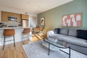 a living room with a couch and a table at Oakland 2br w lounge bbq nr restaurants SFO-1493 in Oakland