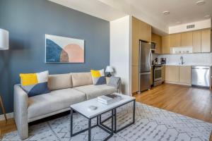 a living room with a couch and a table at Oakland 1br w gym ac nr bart nightlife SFO-1492 in Oakland