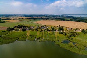 an aerial view of a village and a lake at Ferienhaus Schwalbenhof Lieper Winkel, Rankwitz in Grüssow