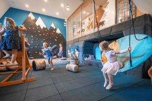 a group of children playing in a indoor climbing gym at Zespół Dolina Białego - Pensjonat Biały Potok in Zakopane