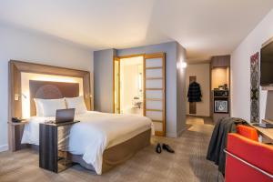 Postel nebo postele na pokoji v ubytování Novotel Mechelen Centrum