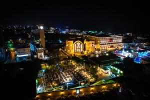 a view of a city at night with lights at The Arkin Colony Hotel in Kyrenia