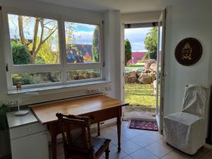 a home office with a desk and a window at Ferienwohnung Waldblick in Heiligenzell