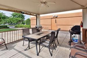 a patio with a table and chairs and a grill at Sonesta Simply Suites Orange County Airport in Santa Ana +16 photos