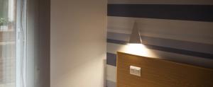 Cama o camas de una habitación en Hostal Bezana