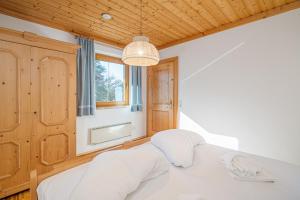 Łóżko lub łóżka w pokoju w obiekcie Appartements Spitzegel