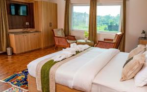 Voodi või voodid majutusasutuse Lumbini Five Elements Hotel toas