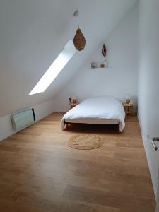 Postel nebo postele na pokoji v ubytování Gîte chez Julie et Franck