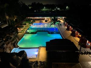an overhead view of a swimming pool at night at Hideaway Resort Banchang in Ban Chang