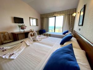 Posteľ alebo postele v izbe v ubytovaní Hotel Alfar