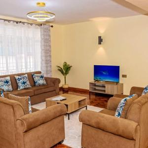 TV a/nebo společenská místnost v ubytování Taliah Homestays