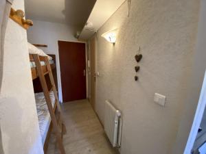 a room with two bunk beds and a hallway at Les Angles - Studio Cabine 21m², 4 Pers, Ascenseur, Parking, Animaux admis - FR-1-758-8 in Les Angles