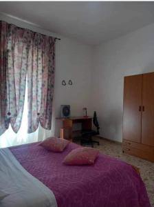 Ein Bett oder Betten in einem Zimmer der Unterkunft Vento di Scirocco
