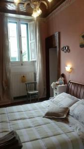 سرير أو أسرّة في غرفة في Casa San Francesco