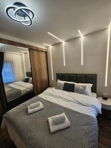 Postel nebo postele na pokoji v ubytování Dajoda Lux