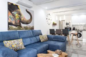 A seating area at Home2Book Palm Beach & Relax