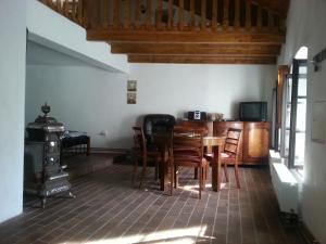 a dining room with a table and chairs at Penzion U Tomáše in Jindřichŭv Hradec