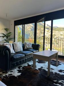 a living room with a couch and a coffee table at Appartement au coeur d'Ordino HUT7872 in Ordino