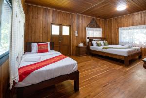 Postel nebo postele na pokoji v ubytování Suk Sabai Homestay