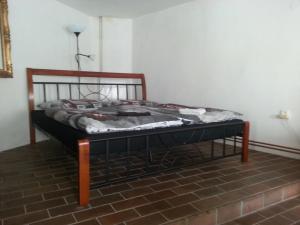 a bed sitting in a room with at Penzion U Tomáše in Jindřichŭv Hradec