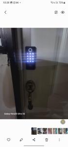 a picture of a bathroom with a blue light at Hotel residencial arlett in Santo Domingo