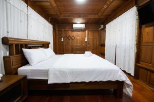 Postel nebo postele na pokoji v ubytování Suk Sabai Homestay