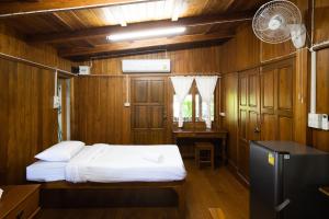 Postel nebo postele na pokoji v ubytování Suk Sabai Homestay