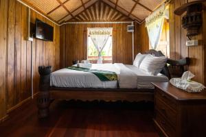 Postel nebo postele na pokoji v ubytování Suk Sabai Homestay
