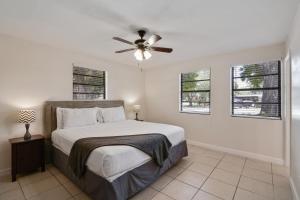 a bedroom with a bed and a ceiling fan at 3 bedroom House with Renovated kitchen and bath! in Cocoa