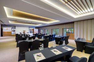 a conference room with black tables and chairs at Megasaray Club Belek in Belek +37 photos
