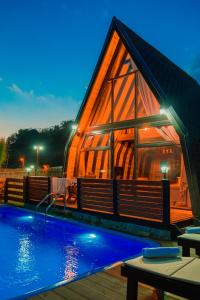 a large wooden house with a pool in front of it at Irmak Vadi Bungalov Zonguldak 