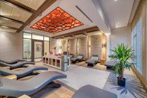 a waiting room with chairs and a table at Megasaray Club Belek in Belek