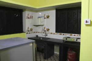 a kitchen with a sink and a counter top at Affordable and Cheapest stay in North Goa - 1BHK in Colovale