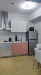 A kitchen or kitchenette at Beach view balcony in Azure Urban Resort Residences