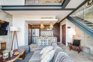 a living room with a couch and a table at Tulum Paradise - Penthouse with Private Pool and Cenote in Tulum