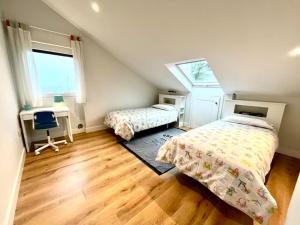 En eller flere senge i et værelse på Casa en la playa