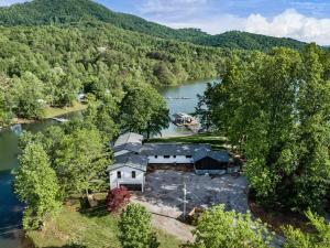 an aerial view of a house next to a river at Tranquille Resort in Hiawassee