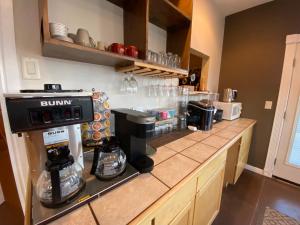 a kitchen with a counter with a coffee maker at SkyRidge Inn in Torrey