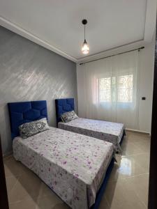 Postel nebo postele na pokoji v ubytování Kenitra Unique Design Appartment